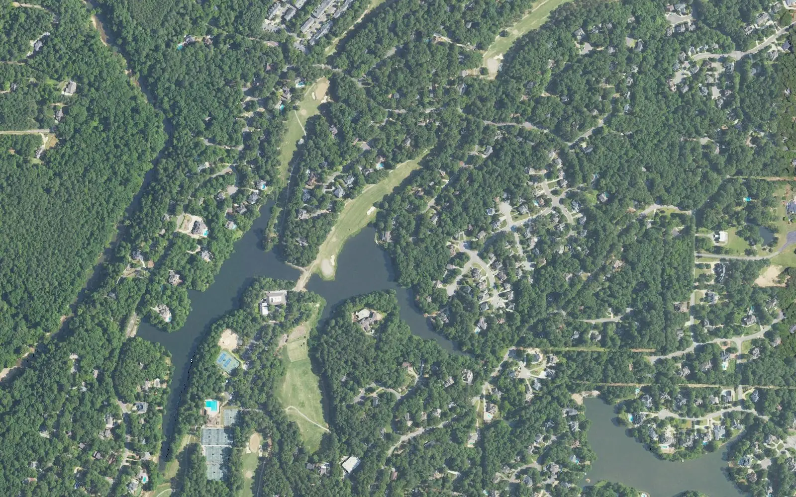 Aerial view of homes, a lake and fairways of the Riverchase Country Club golf course in Riverchase, Hoover.