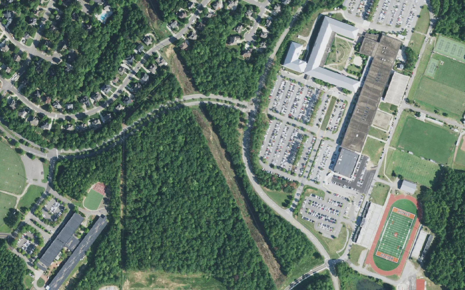 Aerial view of Hoover High School, its stadium and ball fields at right, with Trace Crossings Elementary School at lower left, in Hoover.