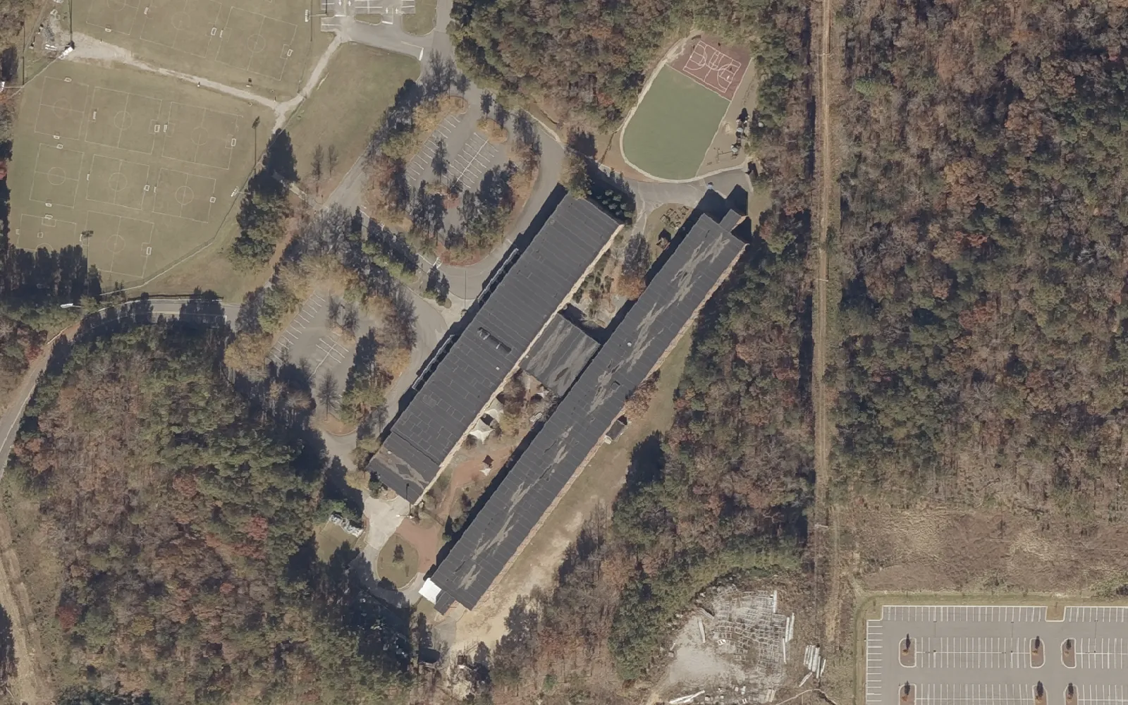 Aerial view of Trace Crossings Elementary School on Learning Lane in Hoover, with its play fields and the woods to the east.