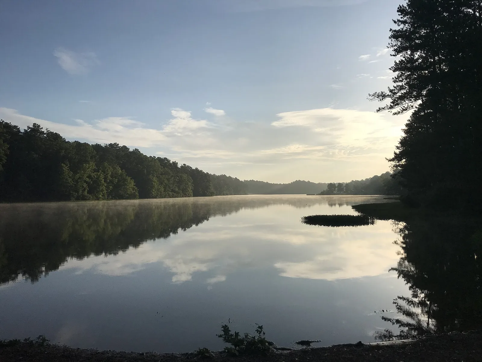Morning mist over the lake at Oak Mountain State Park in Pelham.