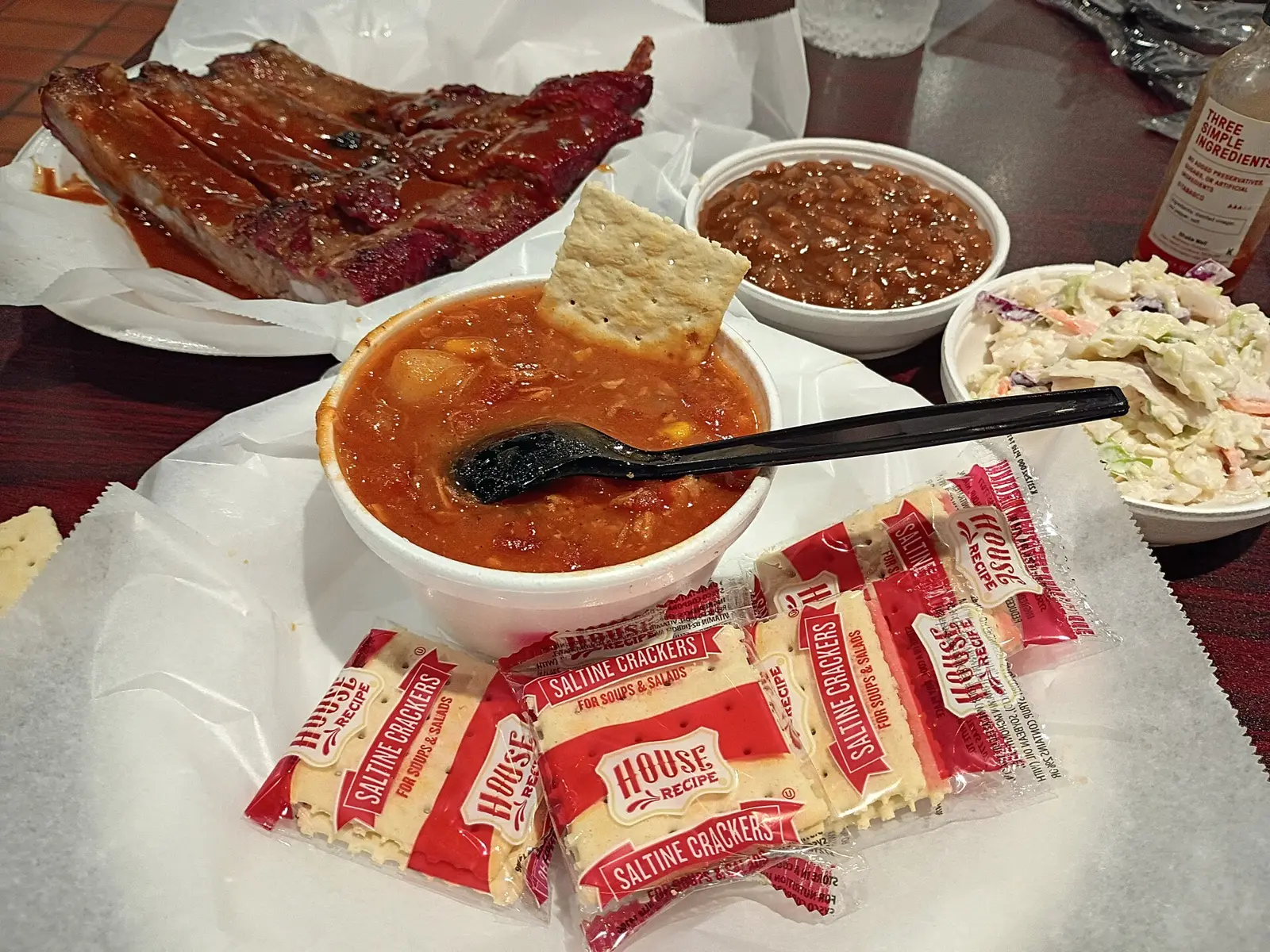 Brunswick stew with crackers, coleslaw, barbecue beans and ribs at Dreamland BBQ on Inverness Corners, one of the restaurants on this list.